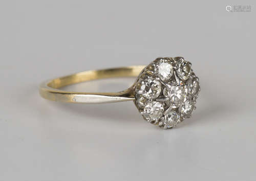 A gold and diamond eight stone cluster ring, claw set with the principal cushion cut diamond