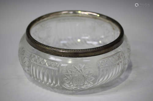 A George V silver mounted cut glass fruit bowl, the silver rim with bead and reel decoration,