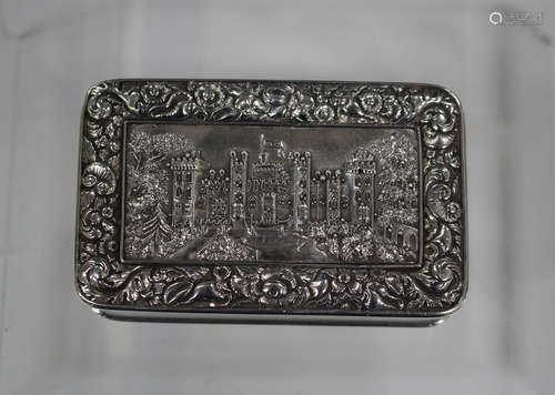 A late George III silver rectangular castle top snuff box, the hinged lid decorated in relief with a