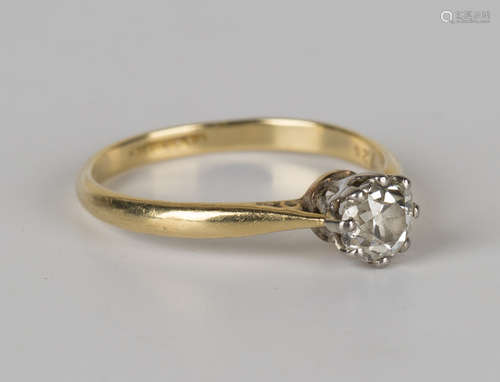 A gold and diamond single stone ring, claw set with a cushion cut diamond, detailed 'Plat.18c', ring