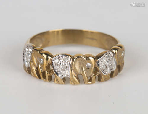 A 9ct gold and diamond ring, designed as a row of three elephants, ring size approx X, with a case.