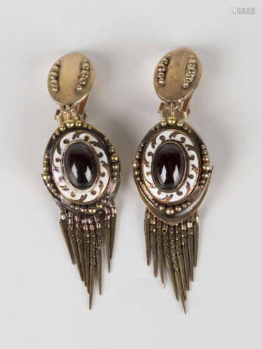 A pair of gold, carbuncle garnet and white enamelled earclips, the principal oval drops and