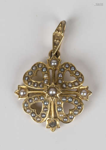 A gold and seed pearl pendant, circa 1910, in a heart shaped quatrefoil design, detailed '15ct',