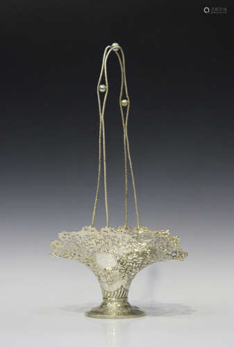 An Edwardian silver flower basket of flared form with cast ropetwist overhead handle, the rim cast