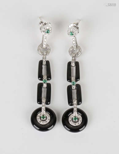 A pair of diamond, emerald and black onyx pendant earrings in an Art Deco inspired design, with post