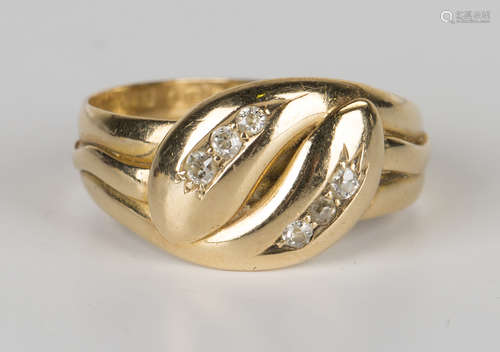 An 18ct gold and diamond ring, designed as a twin headed snake, mounted with two rows of three