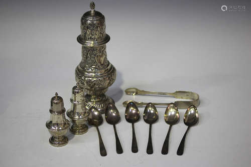 A late Victorian silver sugar caster of baluster form with pierced domed cover, decorated in