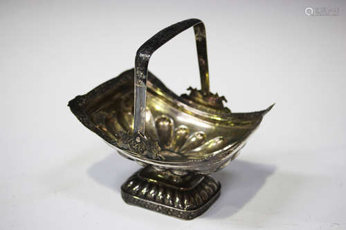 An early 19th century Russian silver bonbon basket, 84 zolotnik, of half-reeded form with foliate