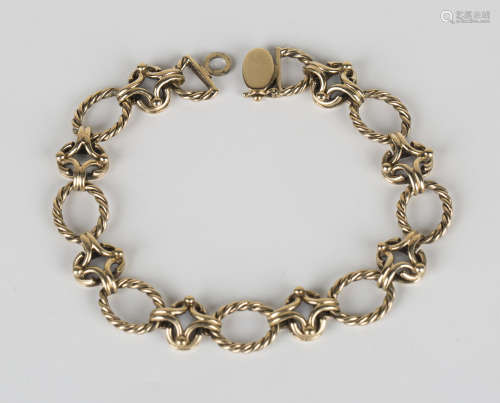 A 9ct gold bracelet in a ropetwist oval and openwork link design with a foldover clasp, length 22.