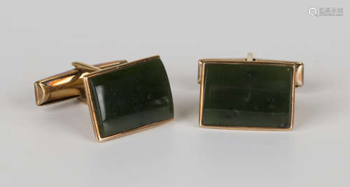 A pair of New Zealand gold mounted jade cufflinks, each with a curved rectangular front, detailed '