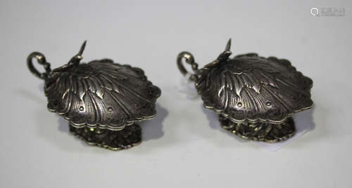 A pair of 20th century Spanish silver shell shaped salts, each hinged lid with bird finial above a