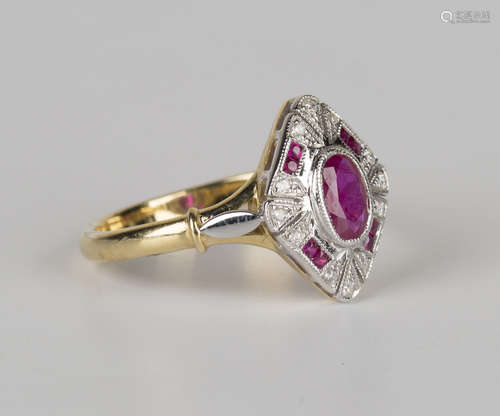 A gold, ruby and diamond lozenge shaped cluster ring, collet set with the principal oval cut ruby