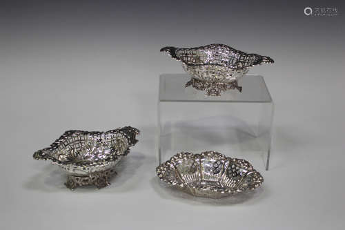 A pair of late Victorian silver bonbon baskets with pierced and embossed decoration, London 1894