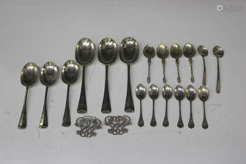 A small group of silver cutlery, including three Hanoverian Rat Tail pattern table spoons and