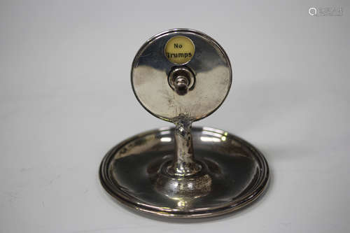 A George V silver trumps marker, the central rotating disc raised above a circular dish shaped