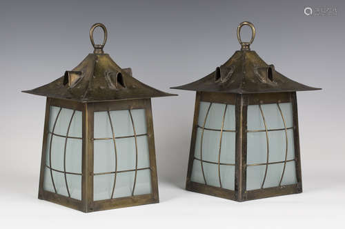 A pair of early 20th century Arts and Crafts Glasgow School anodized brass hall lanterns, the hooded