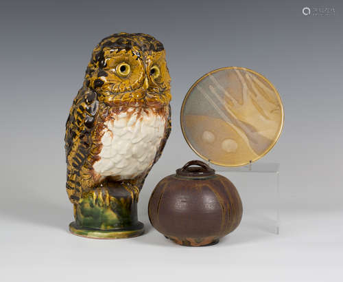 A Chelsea studio pottery model of an owl, mid-20th century, the naturalistic bird perched on a green