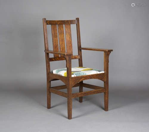 An early 20th century American Mission Arts and Crafts oak framed armchair, designed by Harvey Ellis