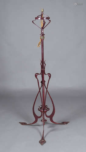 A late Victorian Arts and Crafts painted wrought metal adjustable lamp-standard, converted to