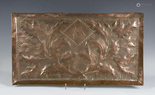 An Edwardian Arts and Crafts rectangular copper tray, worked with a central initial 'M', flanked