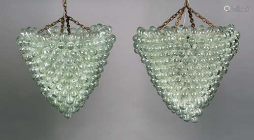 A near pair of mid/late 20th century Italian clear glass chandeliers by Lartigiani, each formed from