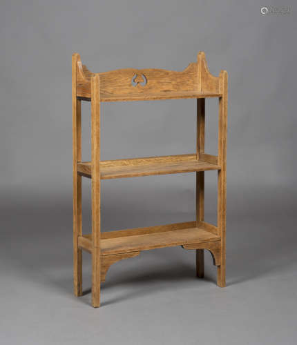 An Edwardian Arts and Crafts oak three-tier bookshelf, attributed to Wylie & Lochhead, the gallery