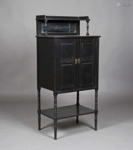 A late Victorian Aesthetic Movement ebonized side cabinet, the mirror shelf back above a pair of