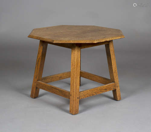 An early 20th century Arts and Crafts Cotswold School oak octagonal occasional table, the deeply