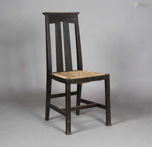 An Edwardian Arts and Crafts ebonized oak side chair by Liberty & Co, the double splat back above