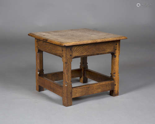 An Arts and Crafts oak square low table by Russell & Sons, Broadway, Worcestershire, probably