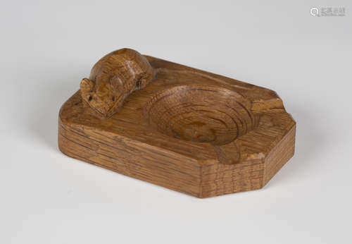 A Robert 'Mouseman' Thompson oak ashtray, the top carved with typical mouse signature, length 10.