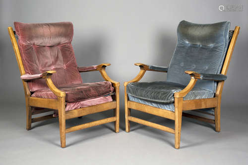 A pair of mid-20th century teak framed armchairs, possibly by Parker Knoll, with unusual shaped