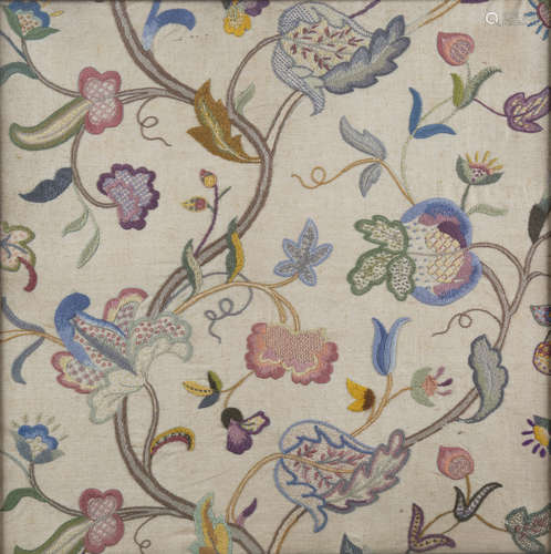 An early 20th century Arts and Crafts crewel work style embroidered panel, worked in coloured