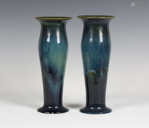 A pair of Ashby Guild stoneware vases, 1909-22, the swollen cylindrical bodies with everted rims and