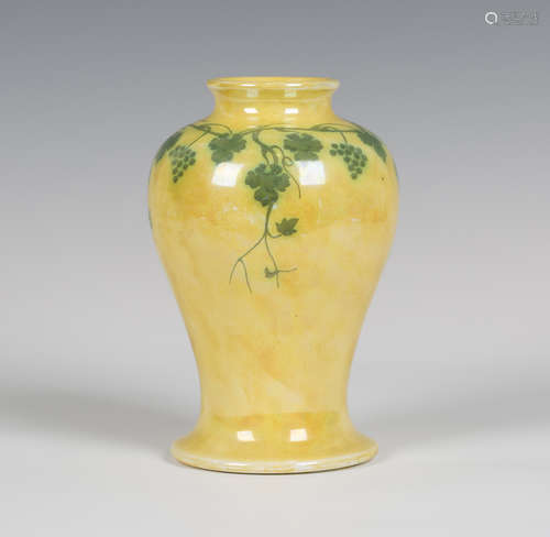 A Ruskin pottery lustre vase, early 20th century, the baluster body painted with trailing green