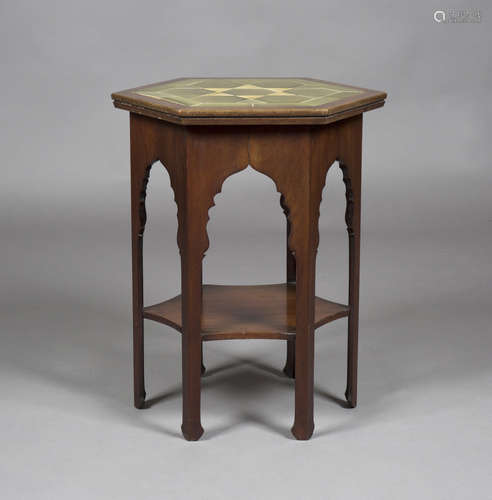 A late Victorian Moorish style mahogany octagonal two-tier occasional table, attributed to Liberty &