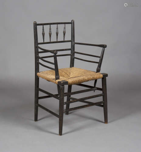 A late Victorian Arts and Crafts ebonized ash Sussex armchair by Morris & Co, designed by Philip