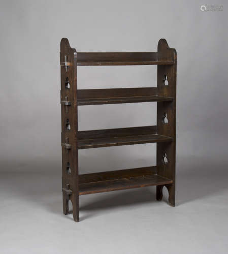 An Edwardian Arts and Crafts stained oak four-tier 'Sedley' bookcase by Liberty & Co, the pegged