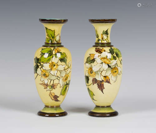 A pair of Doulton faience pottery vases, dated 1898, the ovoid bodies decorated by Mary M. Arding,