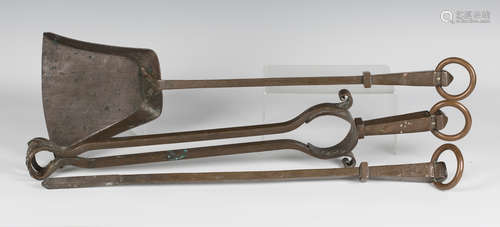 A late 19th/early 20th century Arts and Crafts patinated copper three-piece fire tool set,