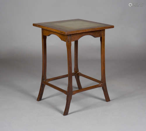 An early 20th century Arts and Crafts walnut framed occasional table, possibly Cotswold School,