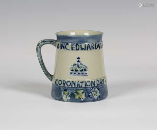 A Moorcroft pottery commemorative mug, circa 1902, of tapered cylindrical shape, commemorating the