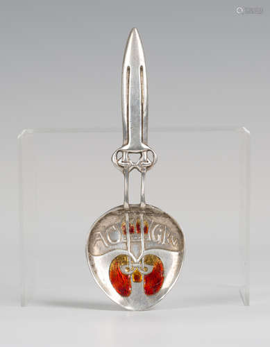 A Liberty & Co 'Cymric' silver and enamelled caddy spoon, designed by Archibald Knox,