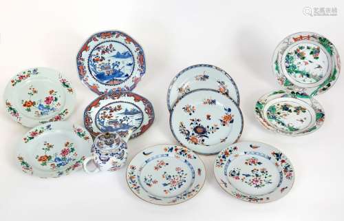 China, 18th century Five pairs of flat plates, including one octagonal, in polychrome porcelain with various Imari, Green Family or PinkFamily decorations One pair with blue mark under cover Diam: 22,5 cmA teapot and its lid (H: 10 cm) are attached(accidents and restorations)