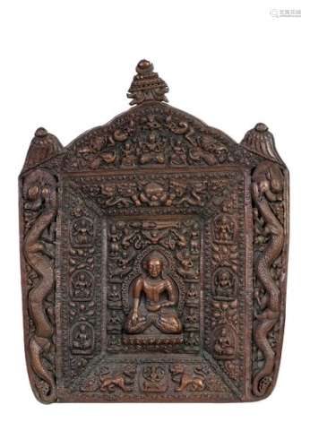 Tibet, 19th century Embossed copperbas-relief mounted on a wooden panel depicting Buddha surrounded by various deities and two dragons on the ends82 x 65 cm