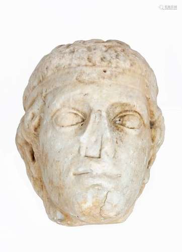 Head with a winning charioteer or deity Carved marble, marks of time (carved nose cavity for later restoration) Gallo-Romanperiod, mid 1st century BC to 3rd century AD27 x 23 x 17 cmProvenance: Belgian collection since the 1930s