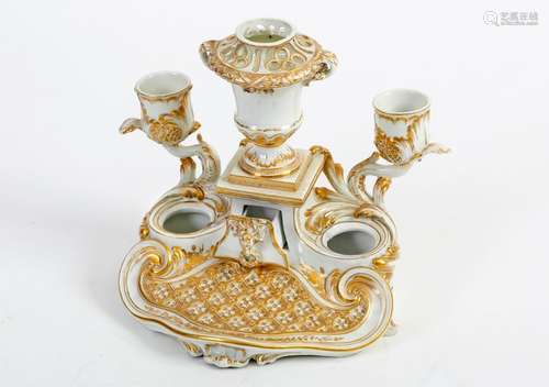 White and gold Tournai porcelain inkwell with two light arms framing a Medici vase with two partially openworkhandles Small drawer decorated with a ram's head in the baseGilded marks with crossed swords and crossbowsEighteenth century19 x 22.5 cm(lacks and restaurations)Bibliography: Eugène Soil, Recherches sur les anciennes porcelaines de Tournay, Paris, 1883, p. 268, illustrated plate XIII