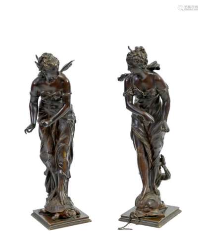 Eutrope BOURET (1833-1906)Young winged woman riding a turtle and Young woman riding a dolphin Pair of bronzes with brown patina Signed BouretH: 41,5 and 42 cm (missing chains)