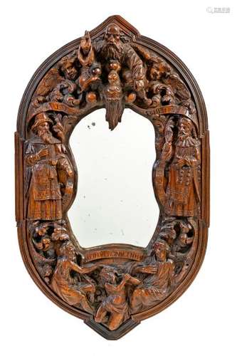 Renaissance style carved walnut carved oval mirror decorated in high relief with figures, phylacteries and angels surrounding God the Father and the Holy Spirit Friesianwork, 17thcentury period 75 x 44 cm(missing parts, accidents and restorations)