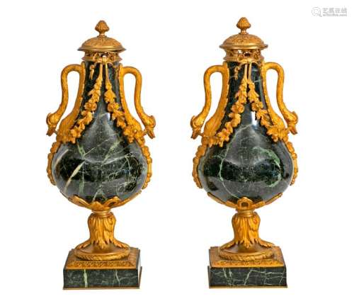Pair of large baluster vases with two swan neck handles and their lid in the Louis XVI style in Sea Green marble and finely chased and gildedbronze French work, 19thcentury H period: 55 cmProvenance: Château de la Roquette (Hainaut)(accidents and restorations)